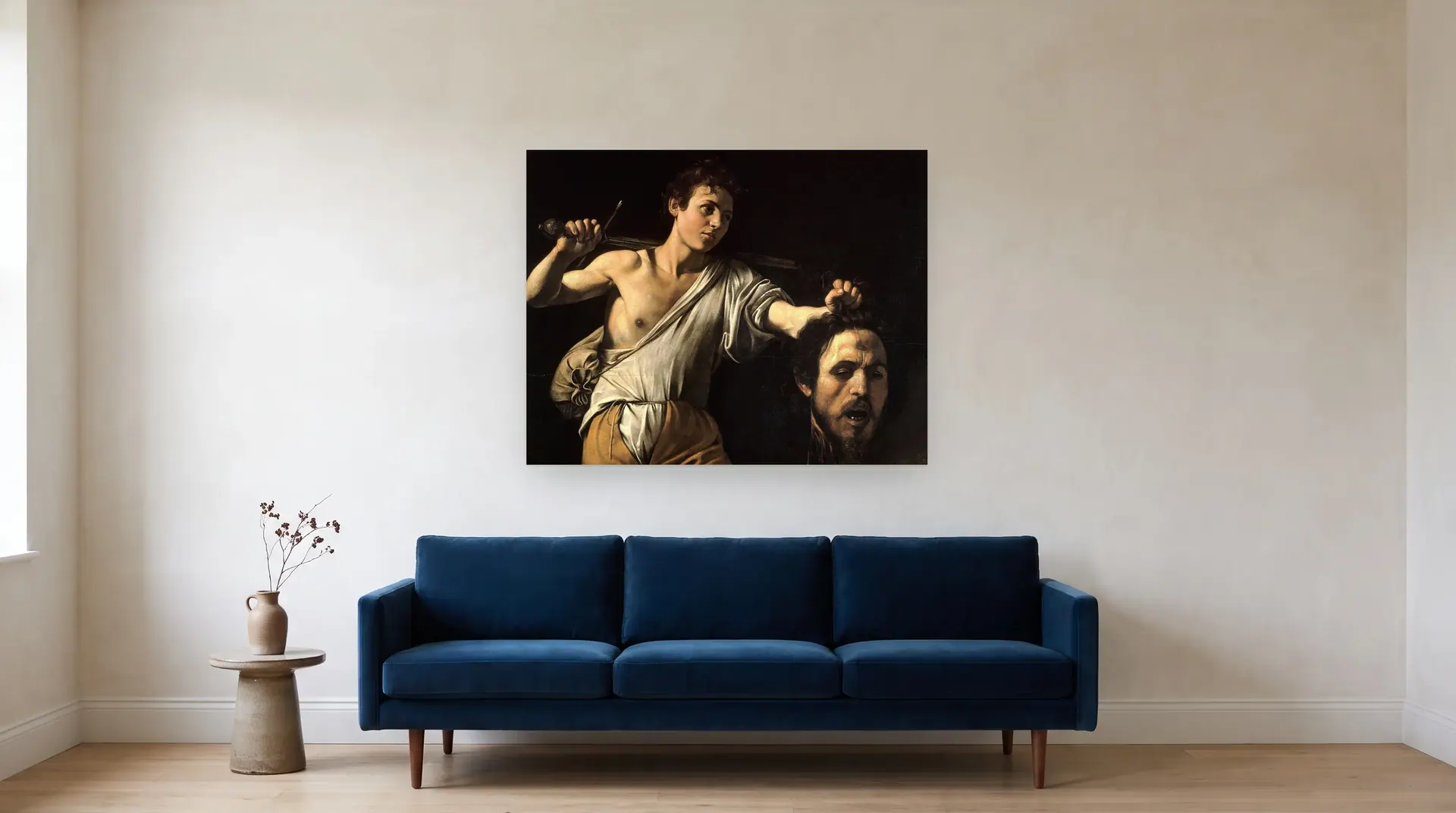 David with the Head of Goliath by Caravaggio shown at its true size, 45½" × 36", over an 84" sofa