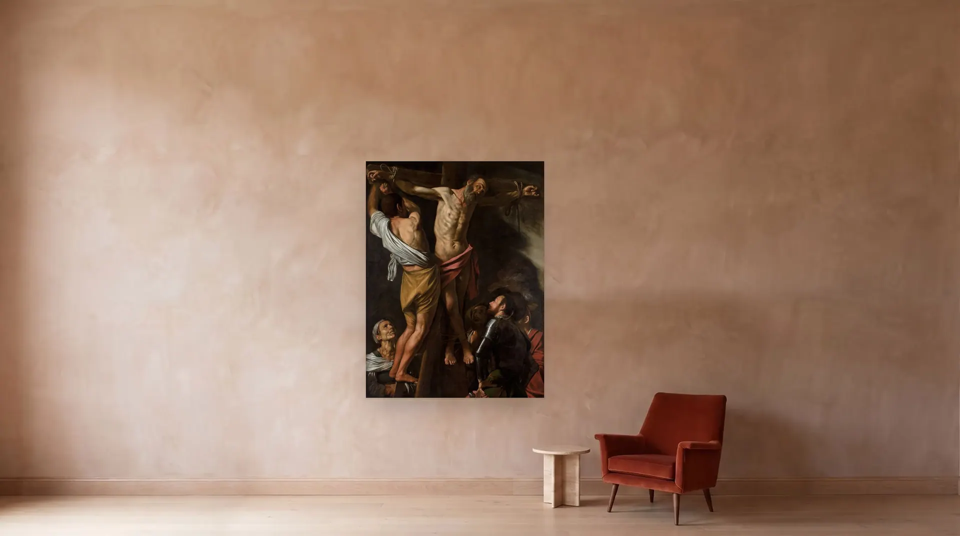 The Crucifixion of Saint Andrew by Caravaggio shown at its true size, 60" × 79½", beside an armchair
