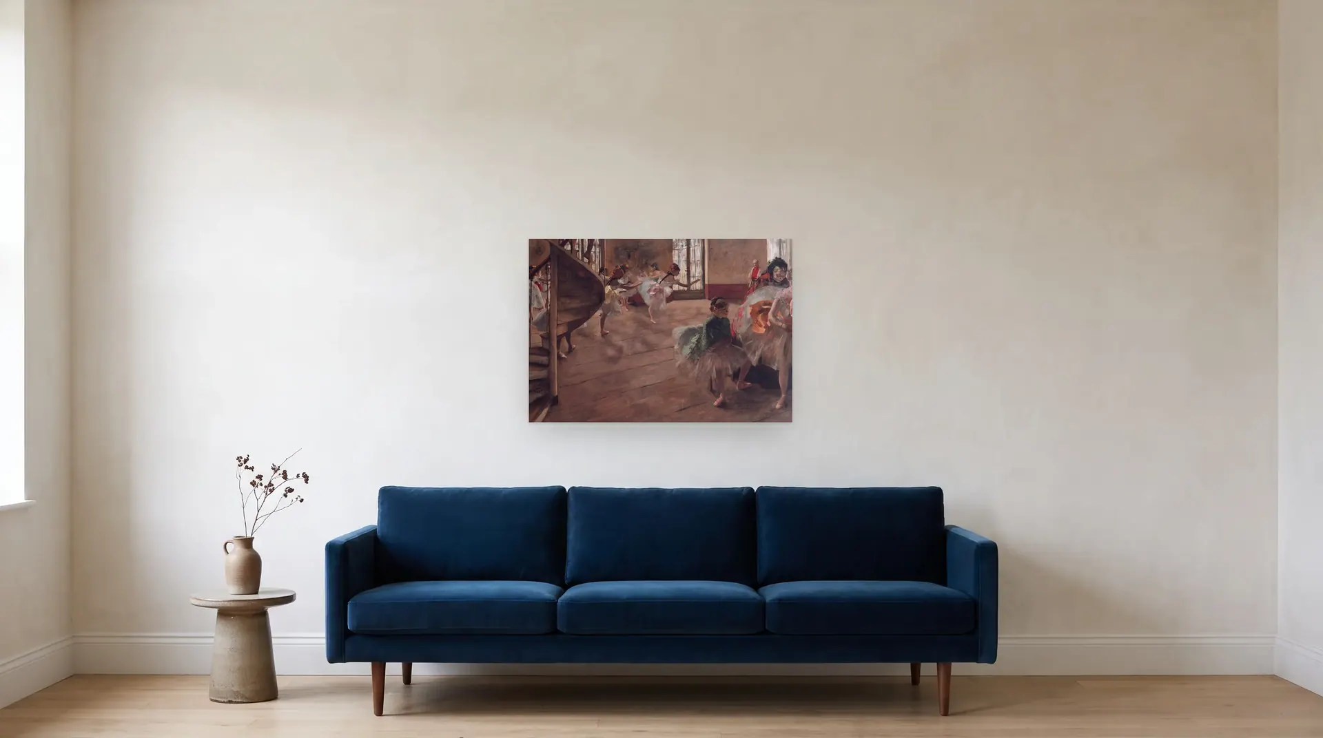 Ballet Rehearsal by Edgar Degas shown at its true size, 33" × 23", over an 84" sofa