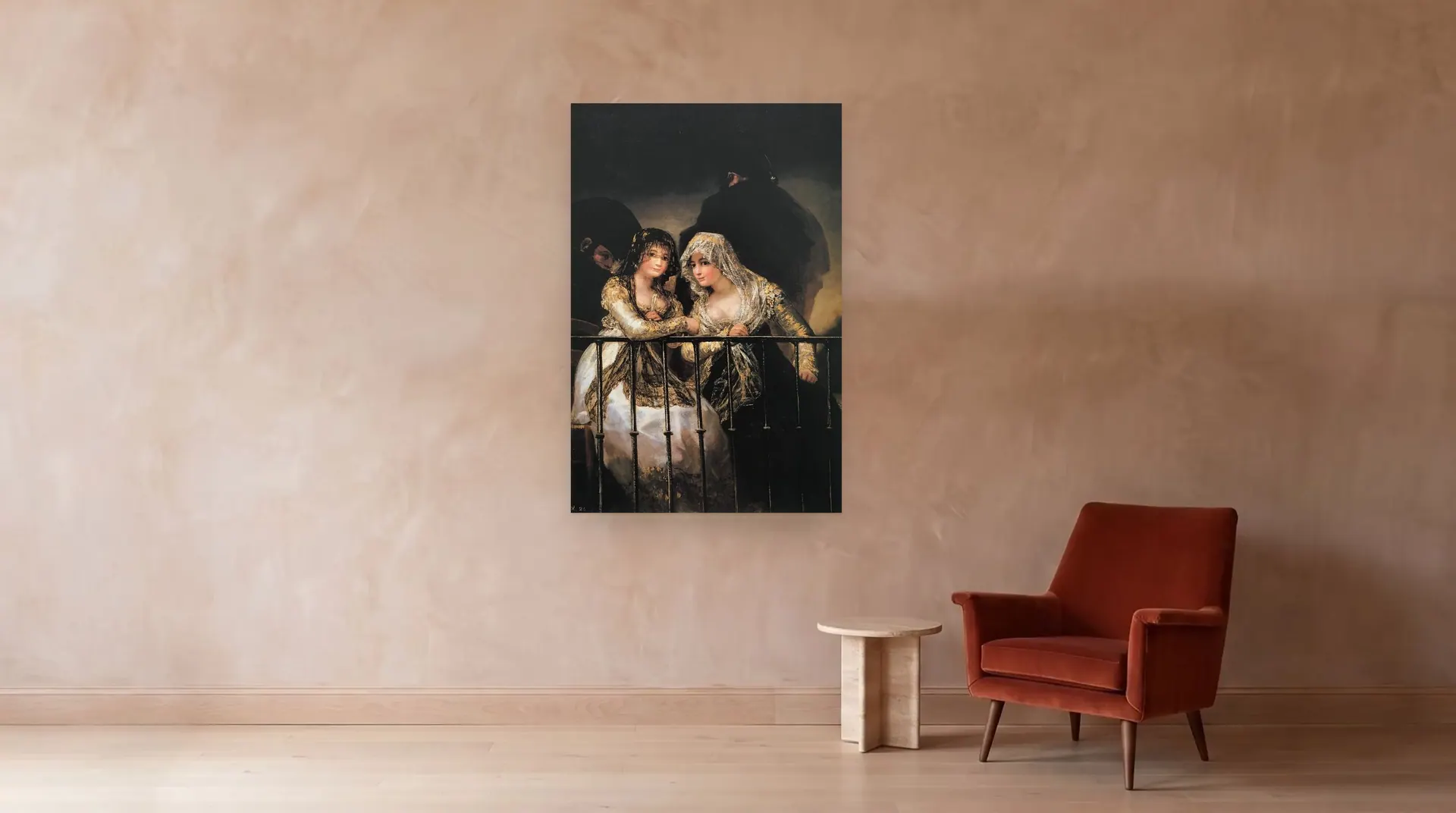 Majas on the Balcony by Francisco Goya shown at its true size, 42" × 64", beside an armchair