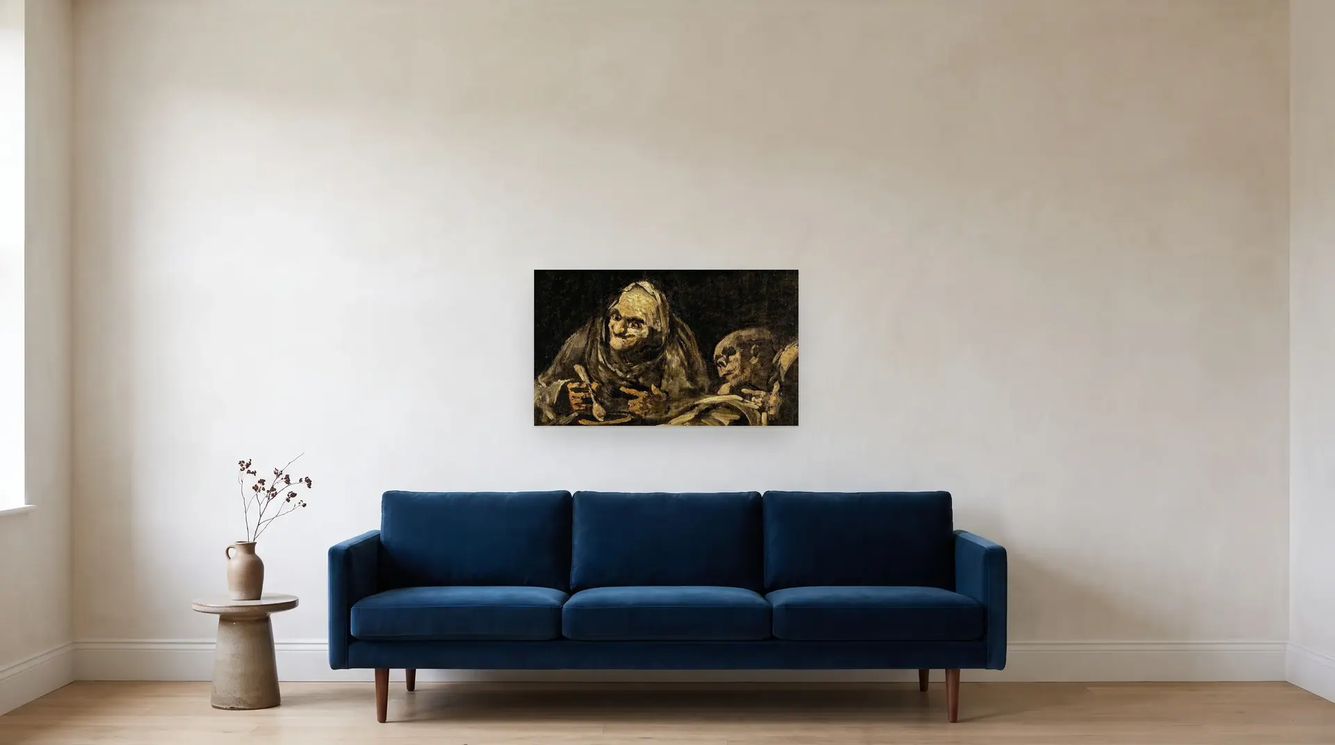 Two Old Men Eating Soup by Francisco Goya shown at its true size, 33" × 19½", over an 84" sofa