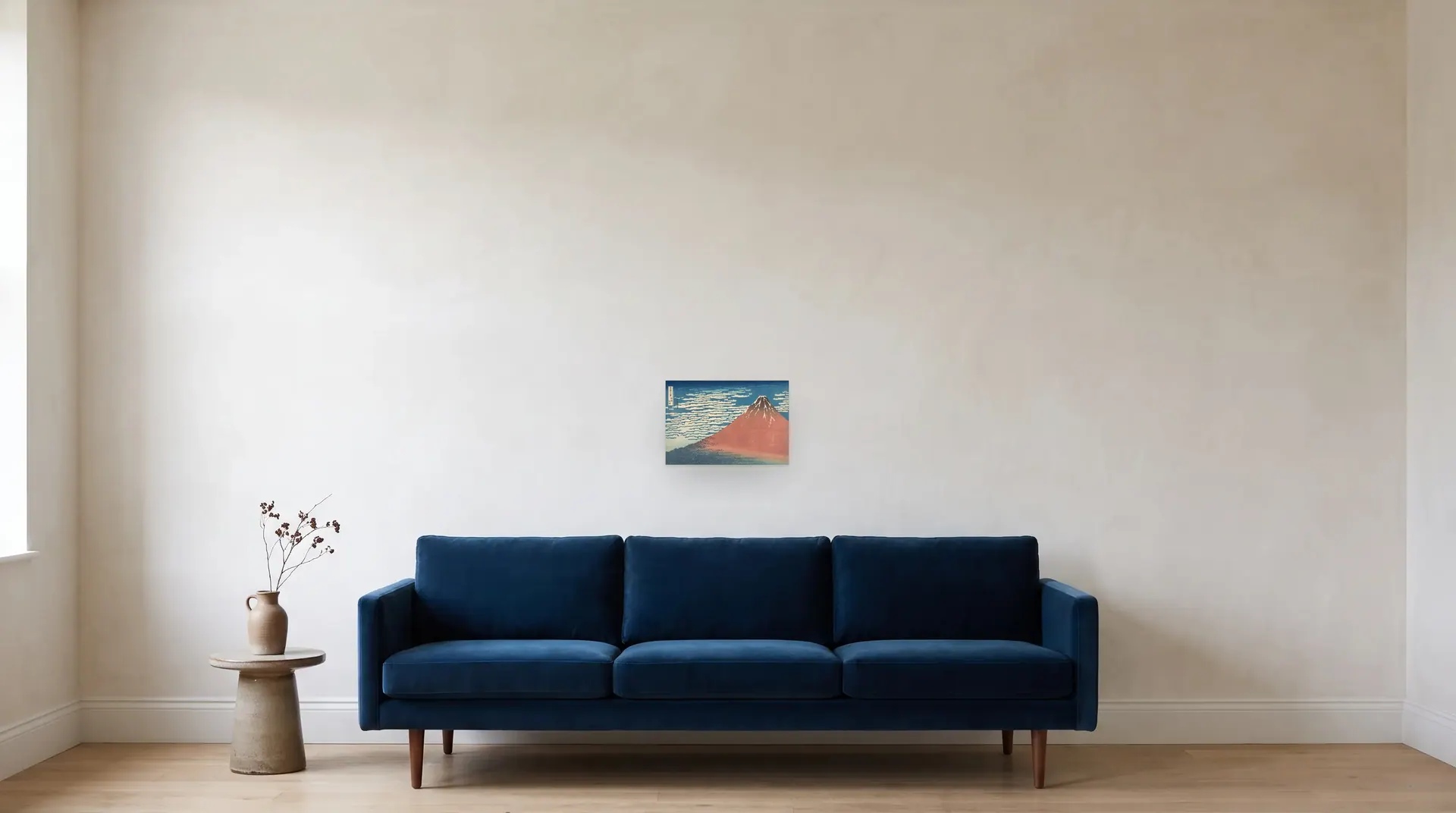 Fine Wind, Clear Morning (Red Fuji) by Katsushika Hokusai shown at its true size, 14" × 9½", over an 84" sofa
