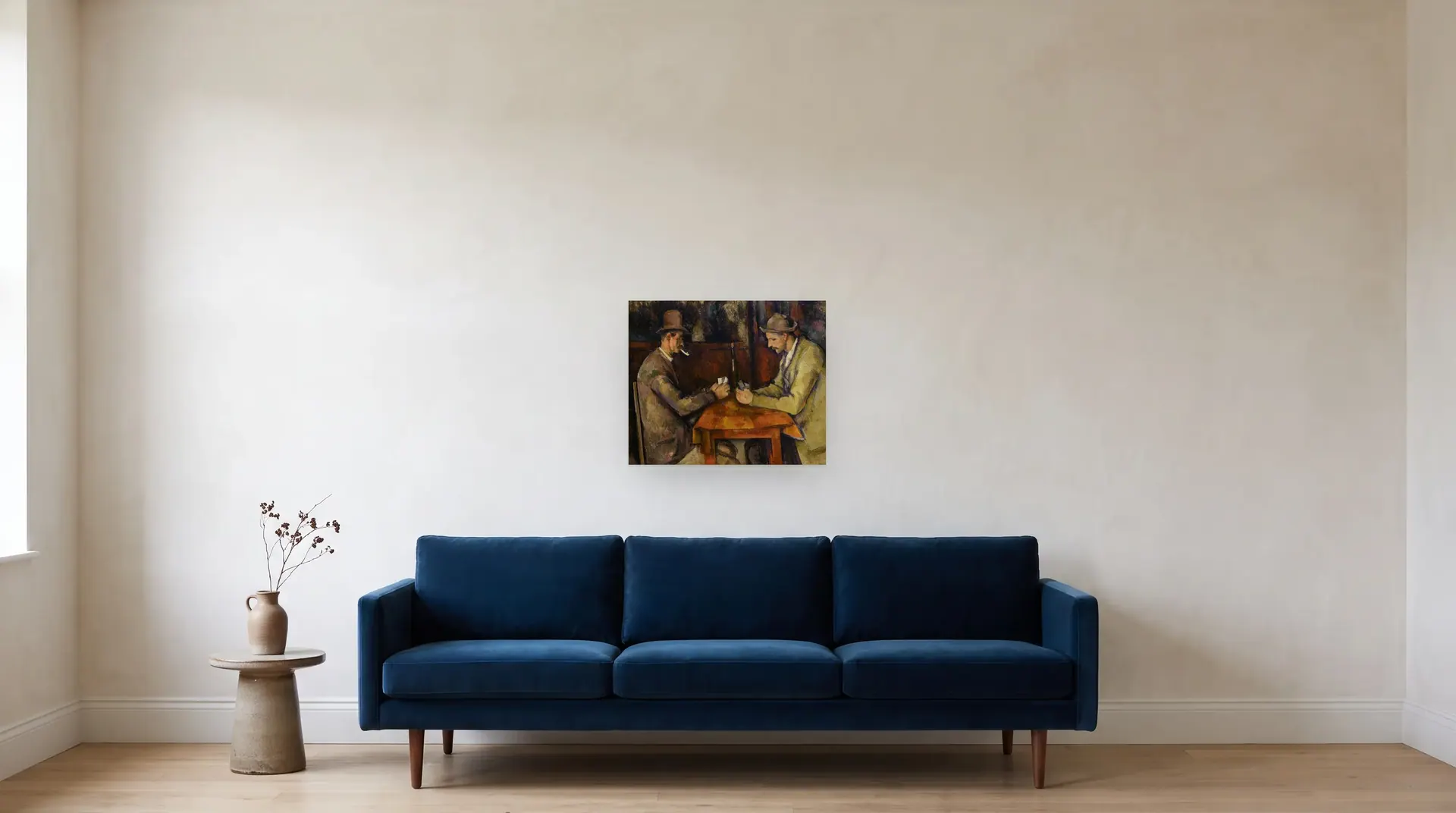 The Card Players by Paul Cézanne shown at its true size, 22½" × 18½", over an 84" sofa