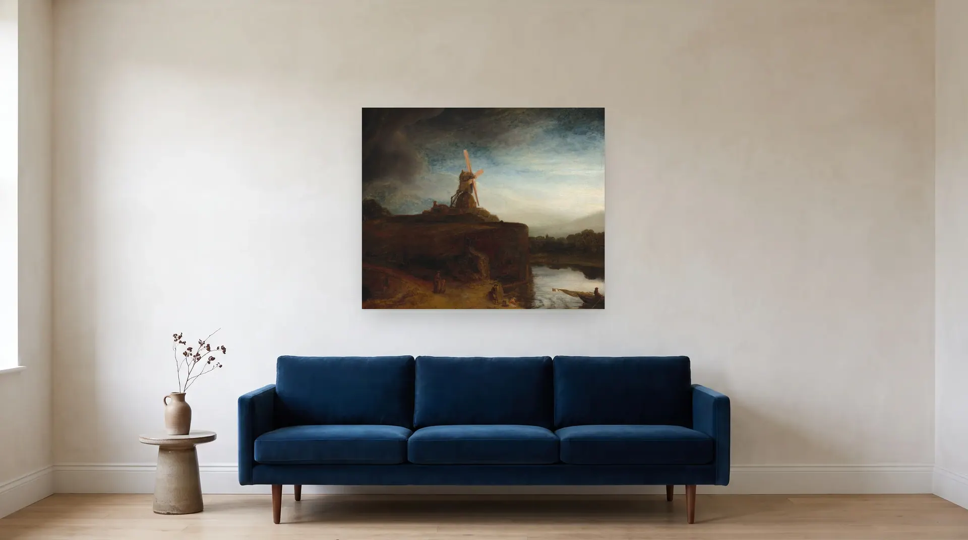 The Mill by Rembrandt shown at its true size, 41½" × 34½", over an 84" sofa