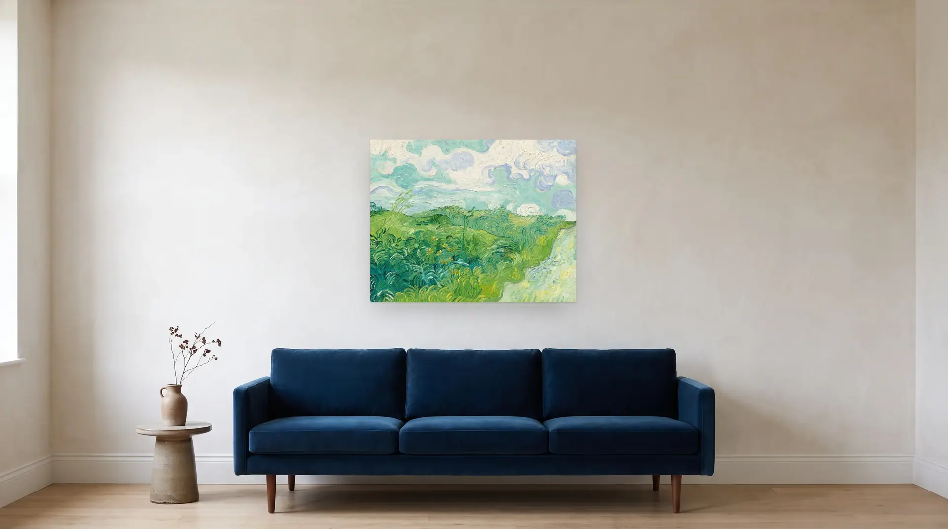 Green Wheat Fields, Auvers by Vincent van Gogh shown at its true size, 36" × 28½", over an 84" sofa
