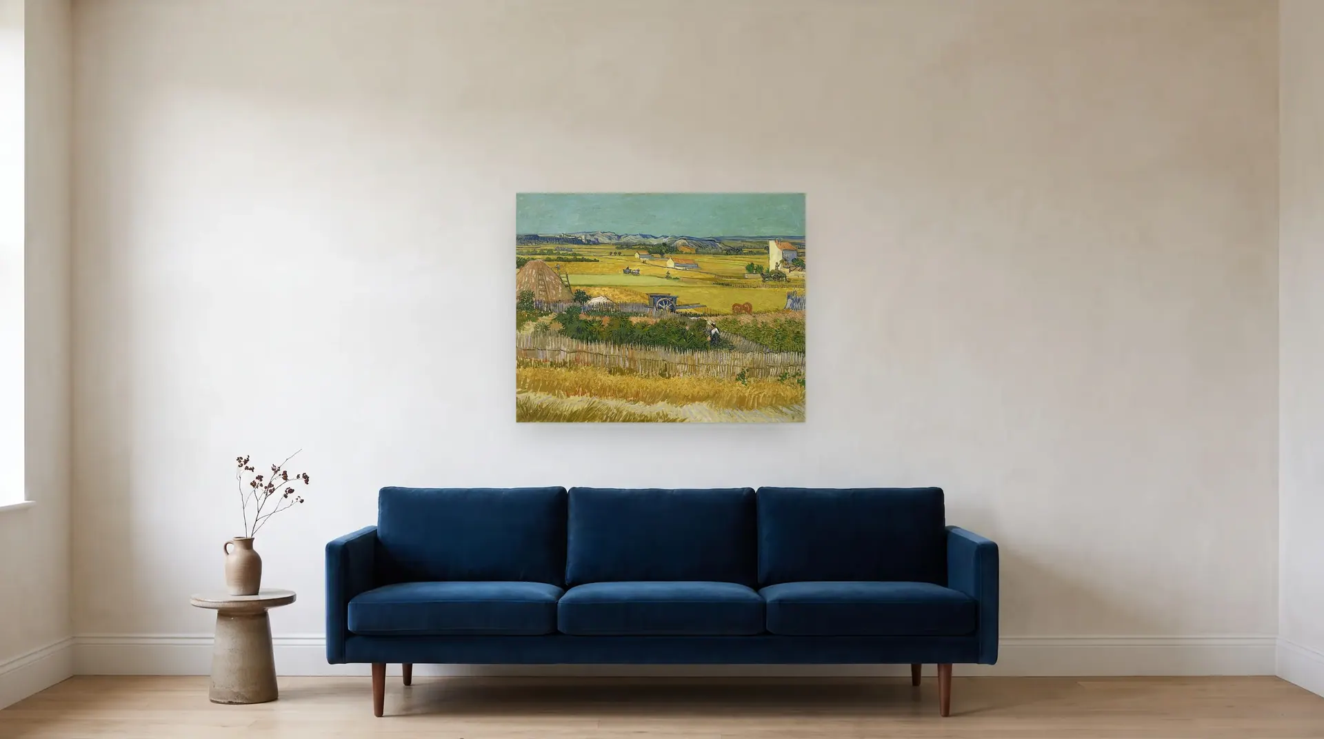 Harvest at La Crau, with Montmajour in the Background by Vincent van Gogh shown at its true size, 36" × 28½", over an 84" sofa